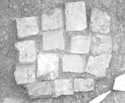 Middle brick course from the Flint House archaeological excavation in porch square J3